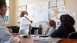 people listening to speaker in a classroom