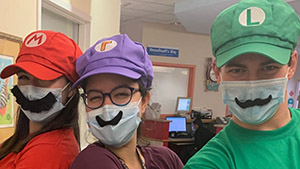 three people dressed up as Super Mario characters
