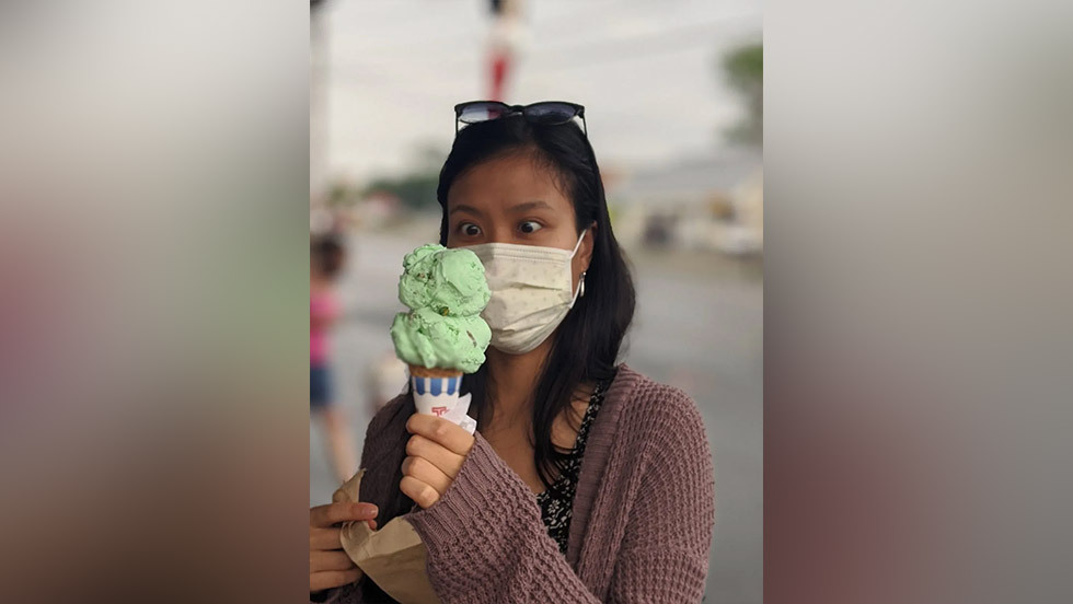person looking at a large ice cream cone