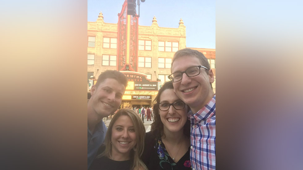 people posing for a photo outside the Providence Performing Arts Center